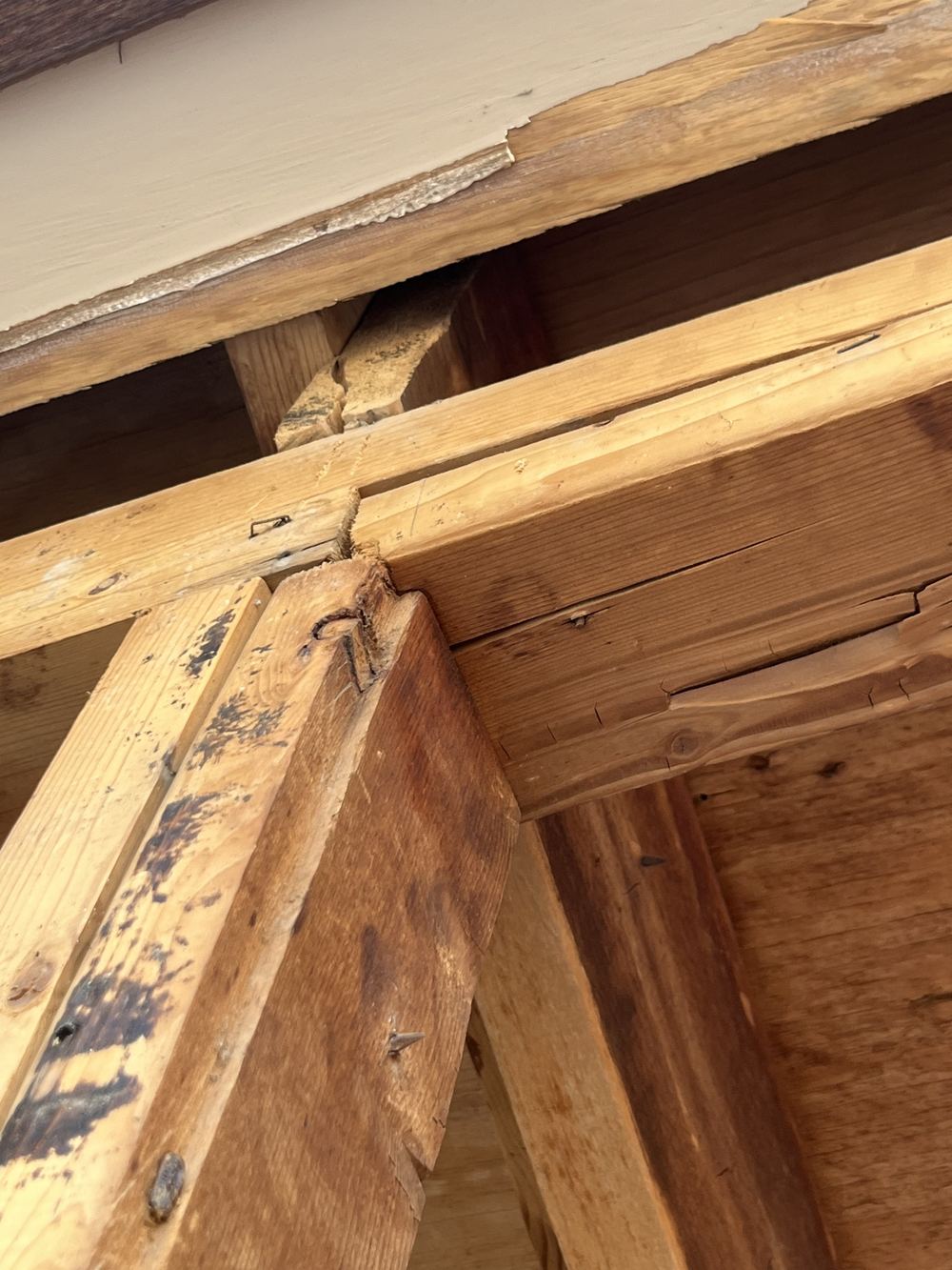 Close-up of old framing where a stud and plate have split along the grain